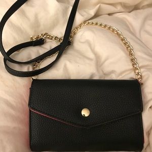 Black and hot pink cross over wallet